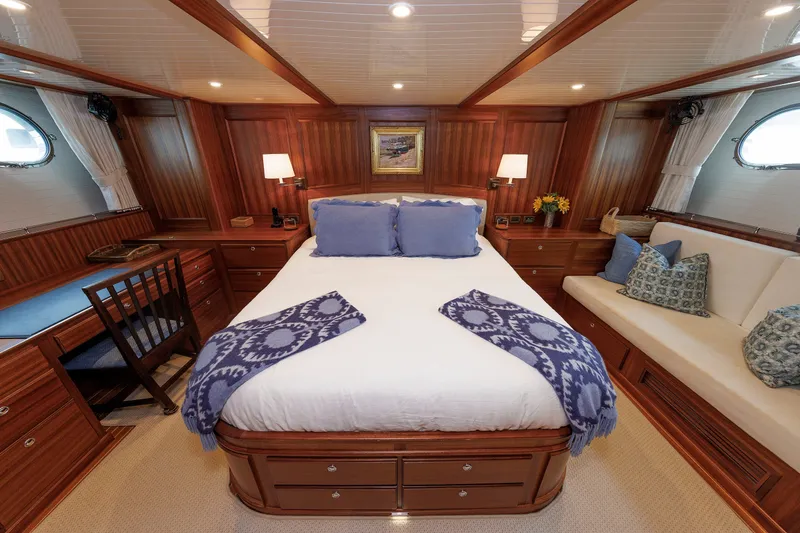 Slide: The Image of Luxurious 2016 Hunt Yachts 72 FB cabin with elegant wood finish and cozy bedding. - 27