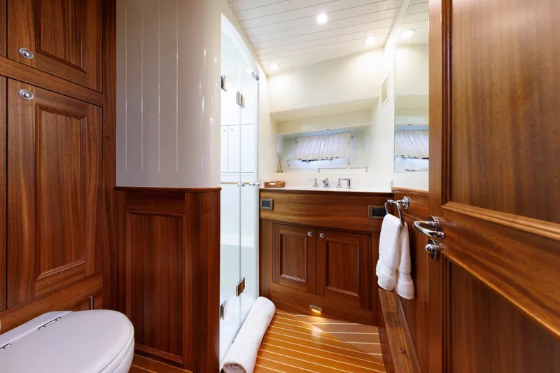 Slide: The Image of Luxurious wooden bathroom interior on 2016 Hunt Yachts 72 FB, featuring elegant fixtures and cabinetry. - 41