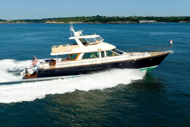 Slide: The Image of 2016 Hunt Yachts 72 FB cruising on open water, showcasing sleek design and luxury. - 82