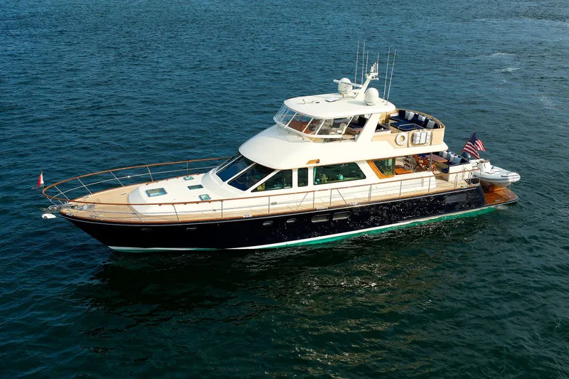 Slide: The Image of Luxury 2016 Hunt Yachts 72 FB cruising on open water, showcasing elegant design. - 78