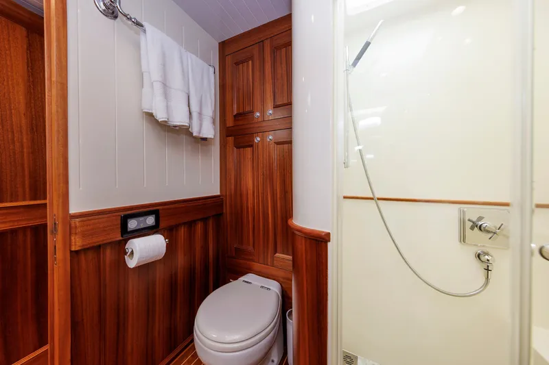 Slide: The Image of Luxurious bathroom in 2016 Hunt Yachts 72 FB, featuring wood paneling and modern fixtures. - 42