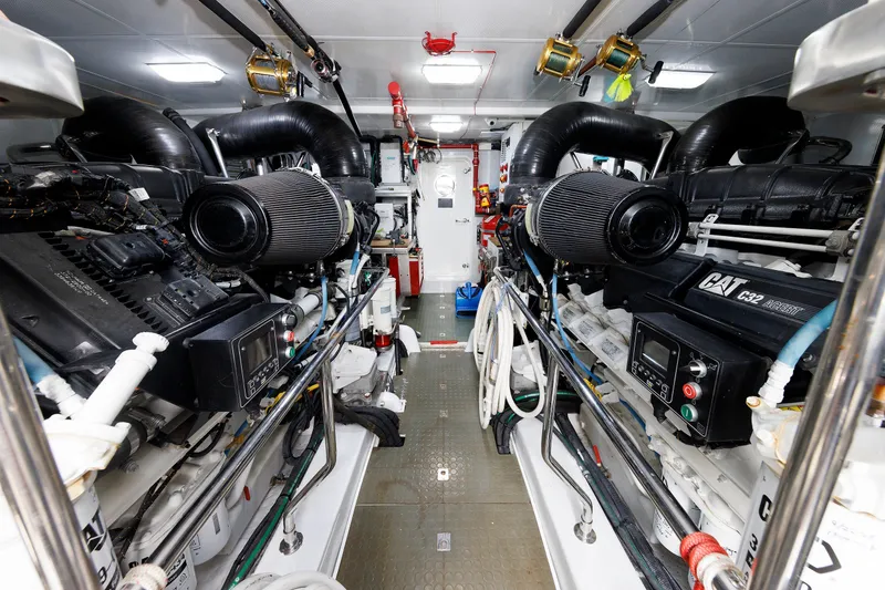 Slide: The Image of Engine room of 2016 Hunt Yachts 72 FB, featuring dual CAT C32 engines. - 67