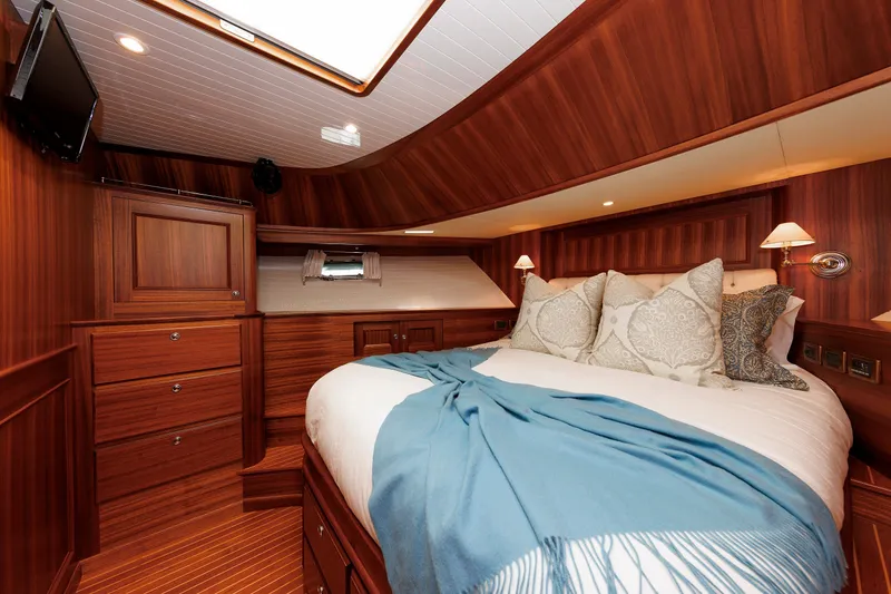 Slide: The Image of Luxurious cabin interior of 2016 Hunt Yachts 72 FB with elegant wood finish and cozy bedding. - 37