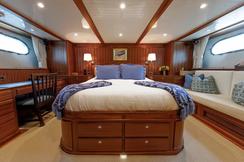 Slide: The Image of Luxurious 2016 Hunt Yachts 72 FB cabin with elegant wood finish and cozy bedding. - 28