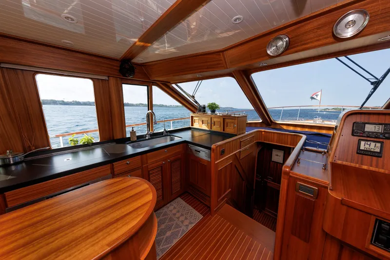 Slide: The Image of Luxurious 2016 Hunt Yachts 72 FB interior with elegant wood finish and ocean view. - 18