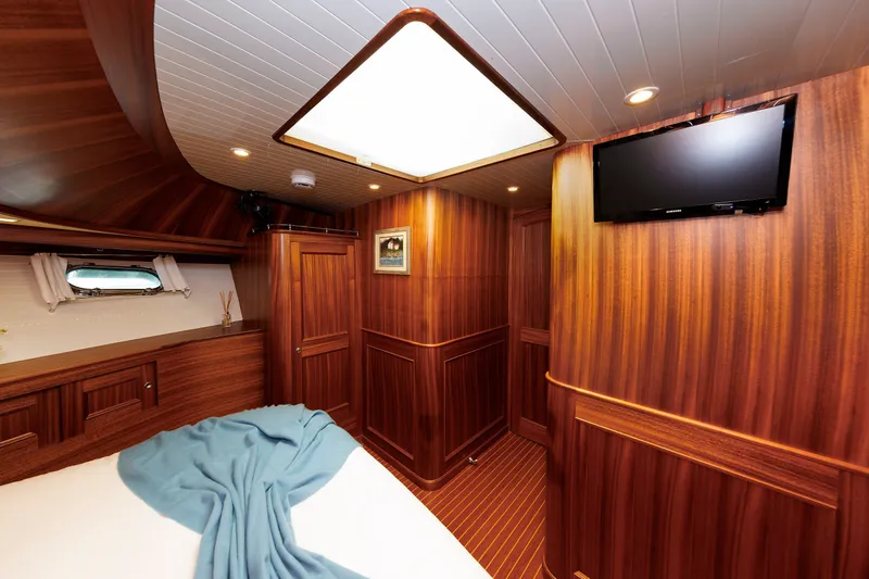 Slide: The Image of Luxurious wooden interior of 2016 Hunt Yachts 72 FB cabin with TV and skylight. - 39