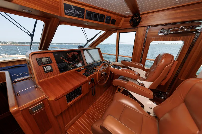 Slide: The Image of Luxurious 2016 Hunt Yachts 72 FB helm with leather seats and advanced navigation system. - 20