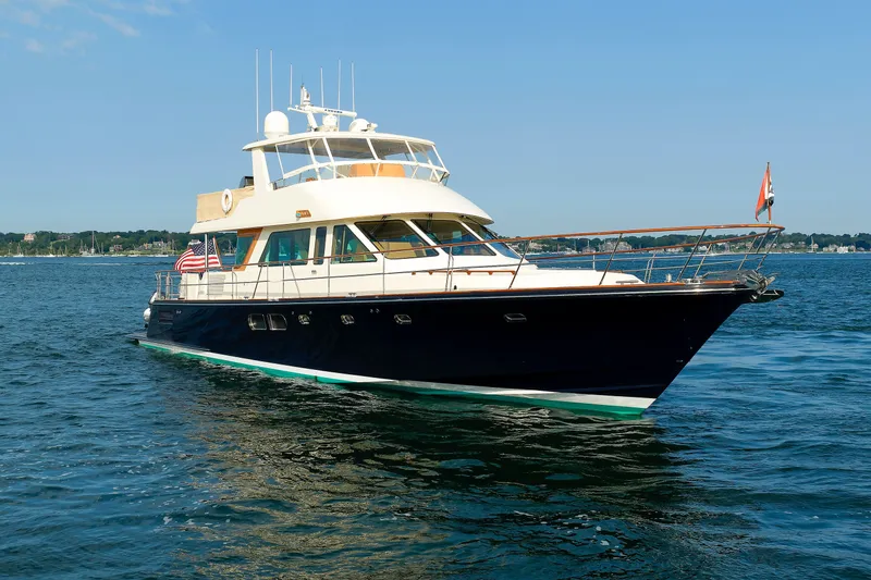 Slide: The Image of 2016 Hunt Yachts 72 FB cruising on calm blue waters. - 76