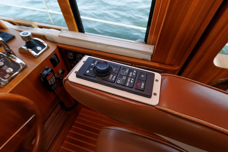 Slide: The Image of Control panel on 2016 Hunt Yachts 72 FB, featuring navigation and steering controls. - 22