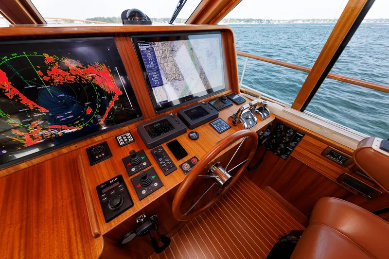 Slide: The Image of Helm of 2016 Hunt Yachts 72 FB with navigation screens and controls. - 21