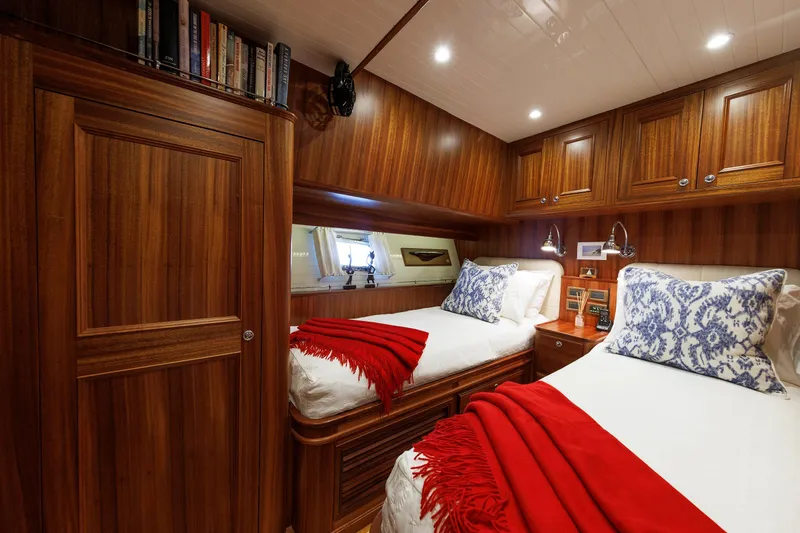 Slide: The Image of Luxurious 2016 Hunt Yachts 72 FB cabin with twin beds, wood paneling, and elegant decor. - 43