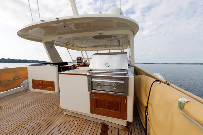 Slide: The Image of Luxury outdoor kitchen on 2016 Hunt Yachts 72 FB, featuring a stainless steel grill. - 50