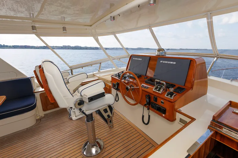 Slide: The Image of Helm of 2016 Hunt Yachts 72 FB with dual Furuno displays and luxurious seating. - 52