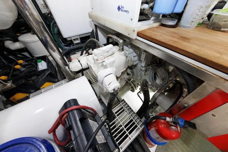 Slide: The Image of Engine room of 2016 Hunt Yachts 72 FB with Sea Recovery system and fire extinguisher. - 70
