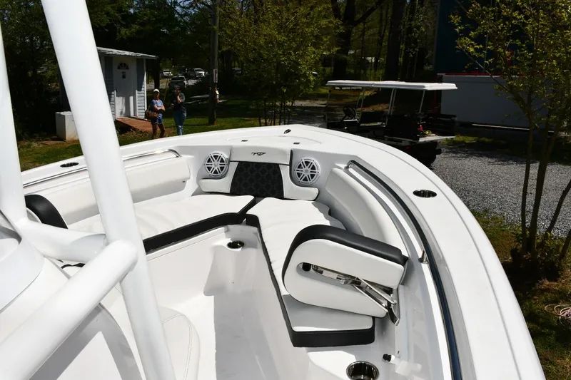 Slide: The Image of 2023 Tidewater 210 LXF boat interior with white seating and modern design. - 9
