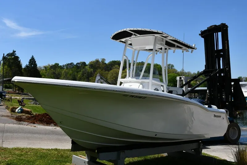 Slide: The Image of 2023 Tidewater 210 LXF boat on display, featuring sleek design and modern amenities. - 3