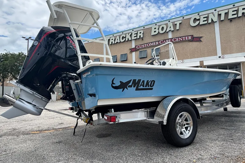 Slide: The Image of 2026 Mako 18 Pro Skiff boat on trailer outside Tracker Boat Center. - 3