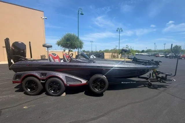 The Image of 2026 Ranger Z521 boat with trailer, parked outdoors under a clear blue sky. - 0