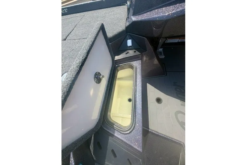 Slide: The Image of Open storage compartment in 2026 Ranger Z521 boat, showcasing interior design. - 9