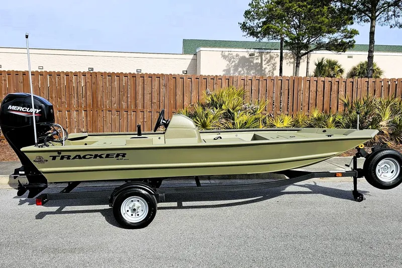 The Image of 2026 Tracker Grizzly 1648 SC boat on trailer, parked outdoors. - 0
