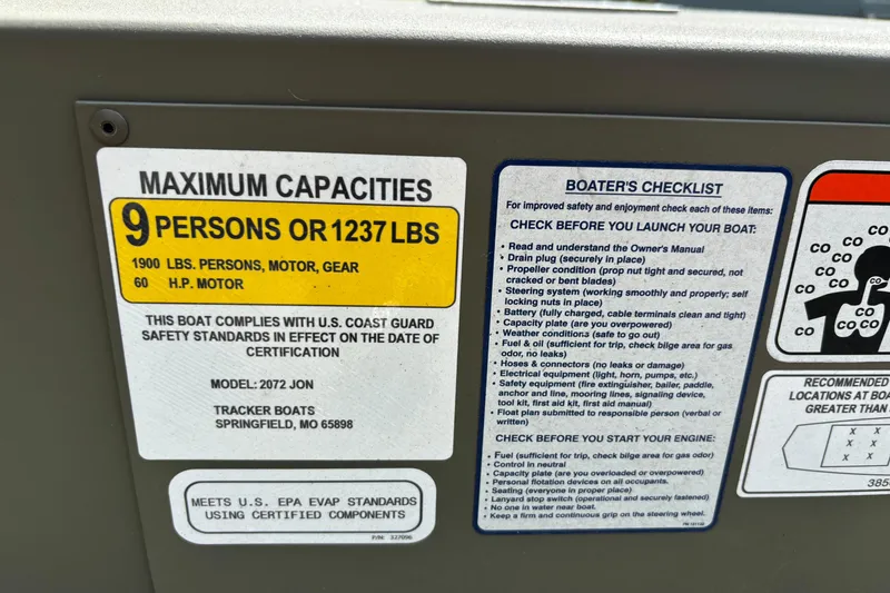 Slide: The Image of Sticker displaying maximum capacities and boater's checklist for Tracker Grizzly 2072 Utility, 2026 model. - 6