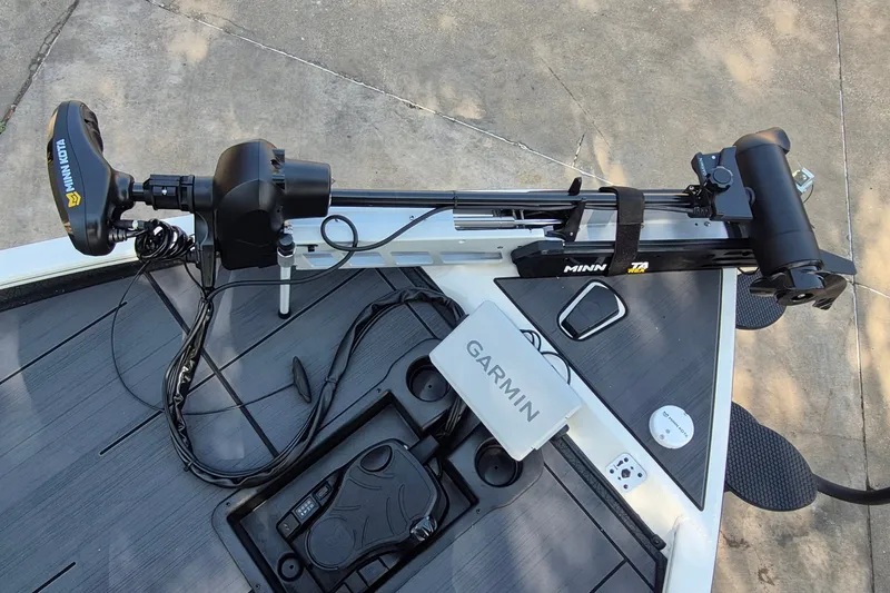Slide: The Image of Trolling motor and Garmin device on 2026 Tracker Savage 215 boat deck. - 14
