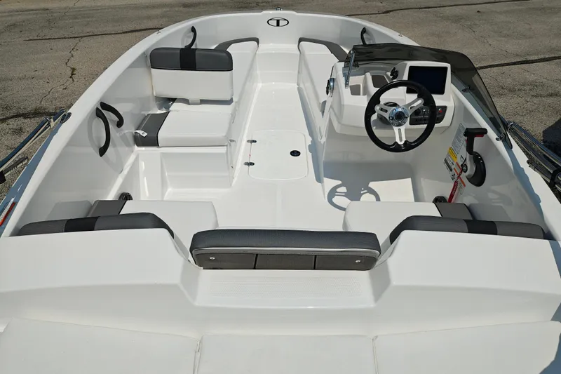 Slide: The Image of 2026 Tahoe T16 boat interior with modern steering and seating arrangement. - 9