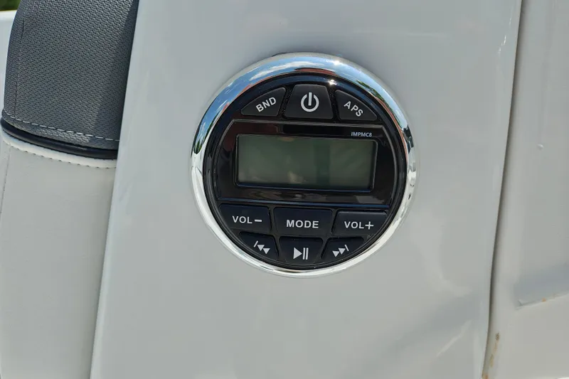Slide: The Image of Audio control panel on a 2026 Tahoe T16 boat, featuring volume and mode buttons. - 16