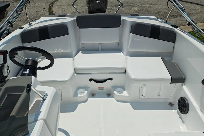 Slide: The Image of 2026 Tahoe T16 boat interior with white seating and steering wheel. - 6