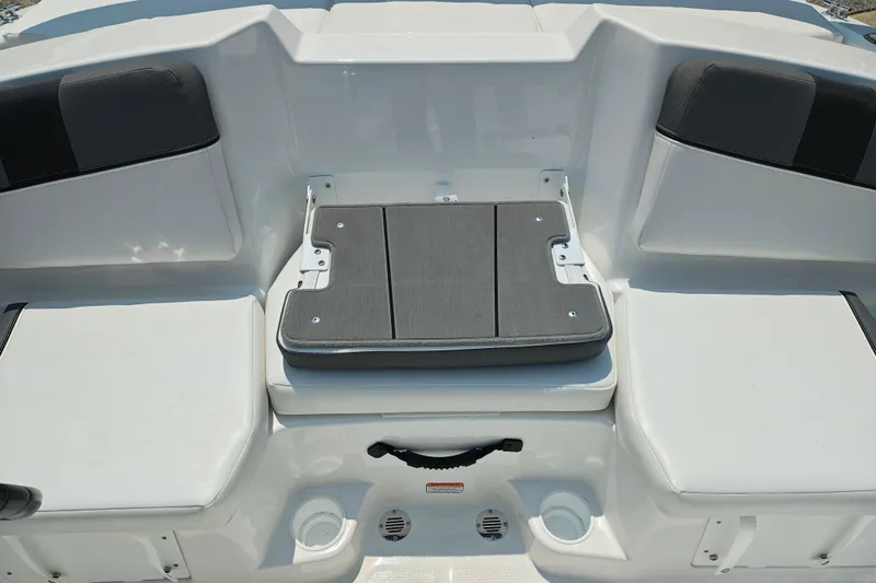 Slide: The Image of 2026 Tahoe T16 boat interior with cushioned seating and storage compartment. - 8