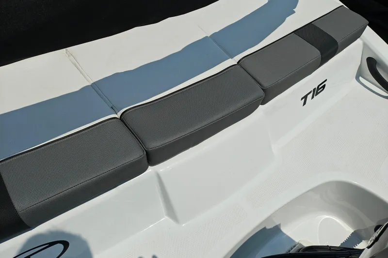 Slide: The Image of 2026 Tahoe T16 boat interior with gray cushioned seating and sleek design. - 10