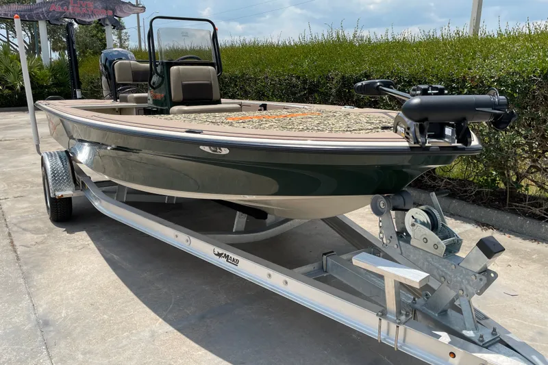 Slide: The Image of 2026 Mako 18 Pro Skiff Backwater Edition on trailer, featuring sleek design and advanced features. - 6