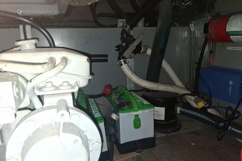 Slide: The Image of Engine room of a 2000 Sea Ray 420 Aft Cabin with visible equipment and battery. - 30
