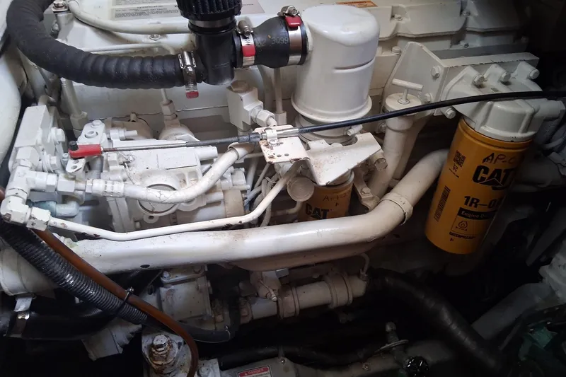 Slide: The Image of Engine compartment of a 2000 Sea Ray 420 Aft Cabin with CAT components visible. - 28