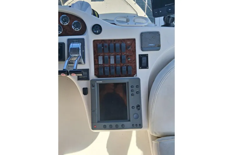 Slide: The Image of Control panel of a 2000 Sea Ray 420 Aft Cabin yacht with navigation equipment. - 24