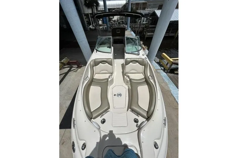 Slide: The Image of 2005 Sea Ray 270 Sundeck boat with spacious seating and sleek design. - 13