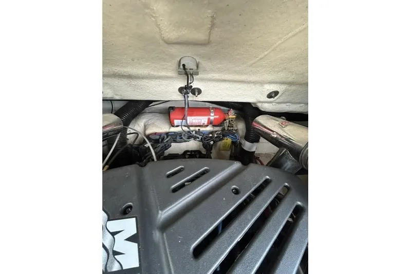 Slide: The Image of Engine compartment of a 2005 Sea Ray 270 Sundeck with visible components and wiring. - 19