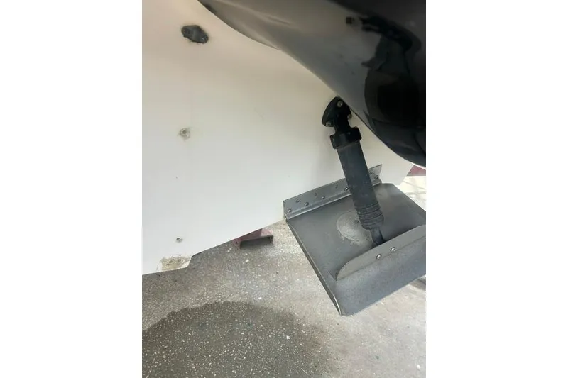 Slide: The Image of Close-up of a 2005 Sea Ray 270 Sundeck boat's trim tab and hydraulic system. - 4