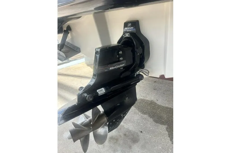 Slide: The Image of MerCruiser outdrive on a 2005 Sea Ray 270 Sundeck boat, close-up view. - 3