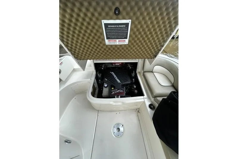 Slide: The Image of Engine compartment of a 2005 Sea Ray 270 Sundeck boat, showcasing a MerCruiser engine. - 9