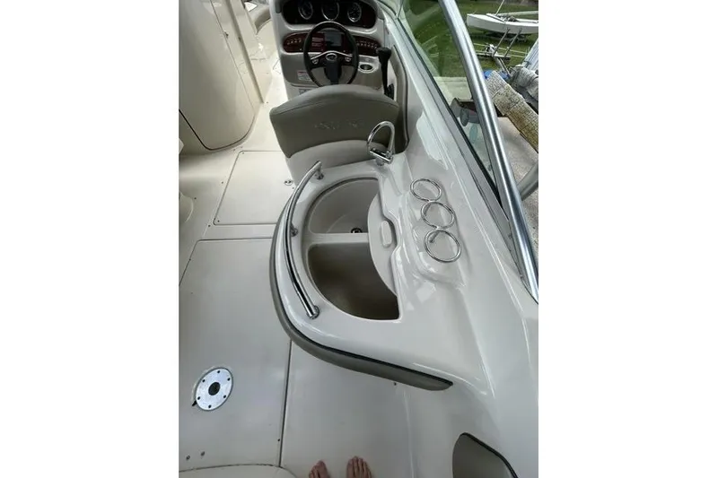 Slide: The Image of 2005 Sea Ray 270 Sundeck interior with helm and sink area. - 18
