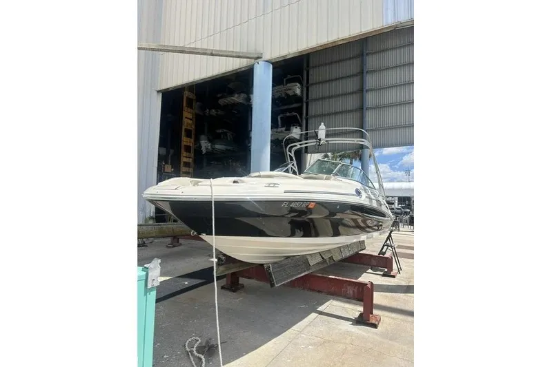 Slide: The Image of 2005 Sea Ray 270 Sundeck boat on dry dock in marina storage facility. - 2