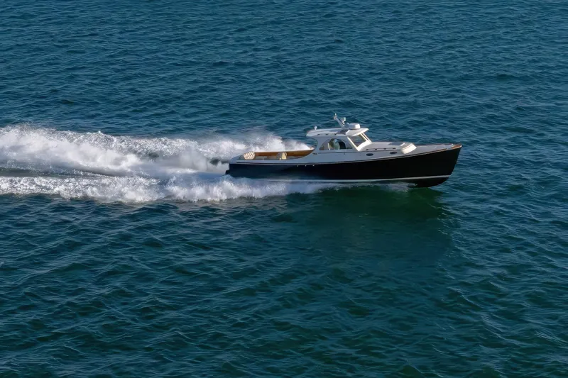 Slide: The Image of 2001 Hinckley Picnic Boat 36 Classic cruising swiftly on open water. - 6