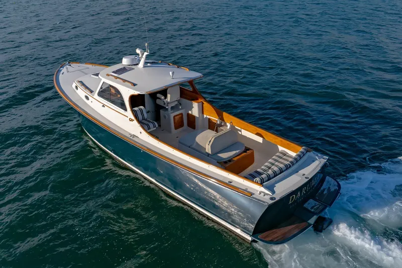 Slide: The Image of 2001 Hinckley Picnic Boat 36 Classic cruising on open water, showcasing elegant design. - 13