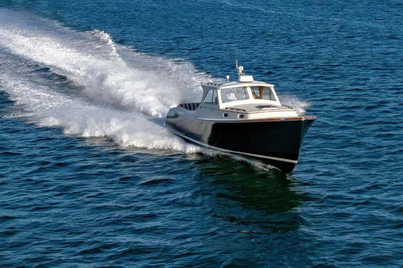 Slide: The Image of 2001 Hinckley Picnic Boat 36 Classic cruising on open water. - 9