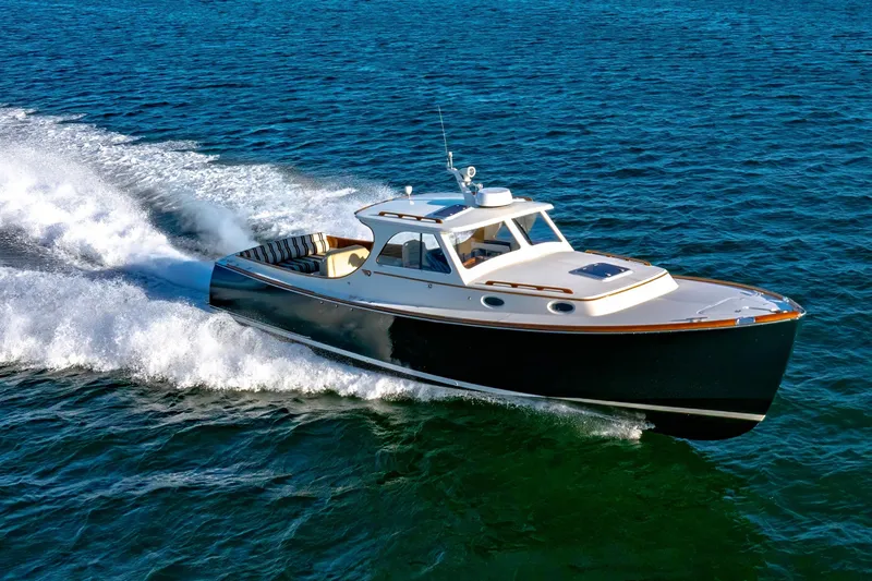 Slide: The Image of 2001 Hinckley Picnic Boat 36 Classic cruising on open water. - 10