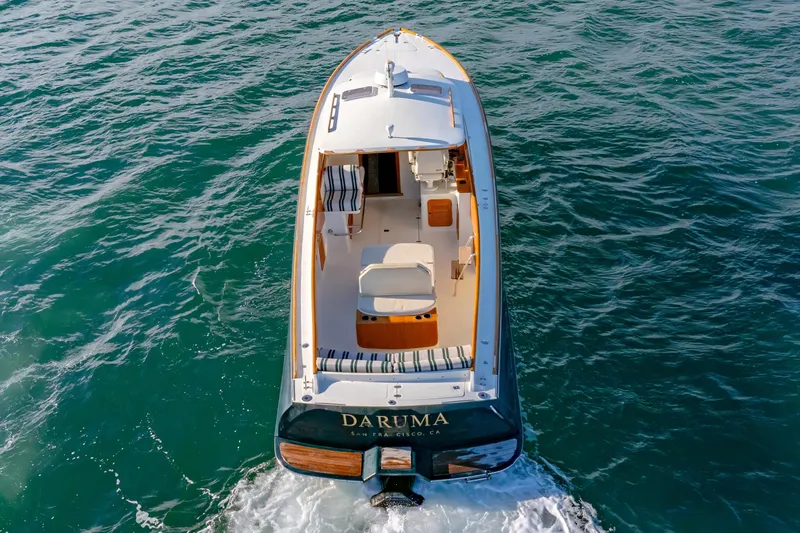 Slide: The Image of 2001 Hinckley Picnic Boat 36 Classic cruising on open water, aerial view. - 14