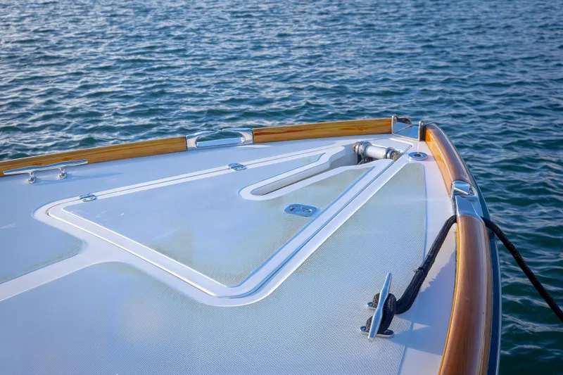Slide: The Image of Bow of 2001 Hinckley Picnic Boat 36 Classic on calm water. - 15
