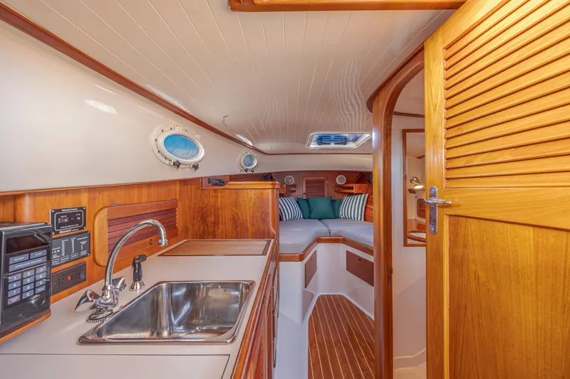 Slide: The Image of Interior of 2001 Hinckley Picnic Boat 36 Classic with cozy cabin and kitchenette. - 27
