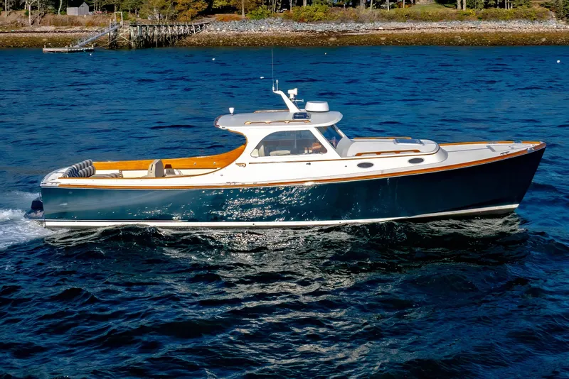 Slide: The Image of 2001 Hinckley Picnic Boat 36 Classic cruising on blue water. - 2